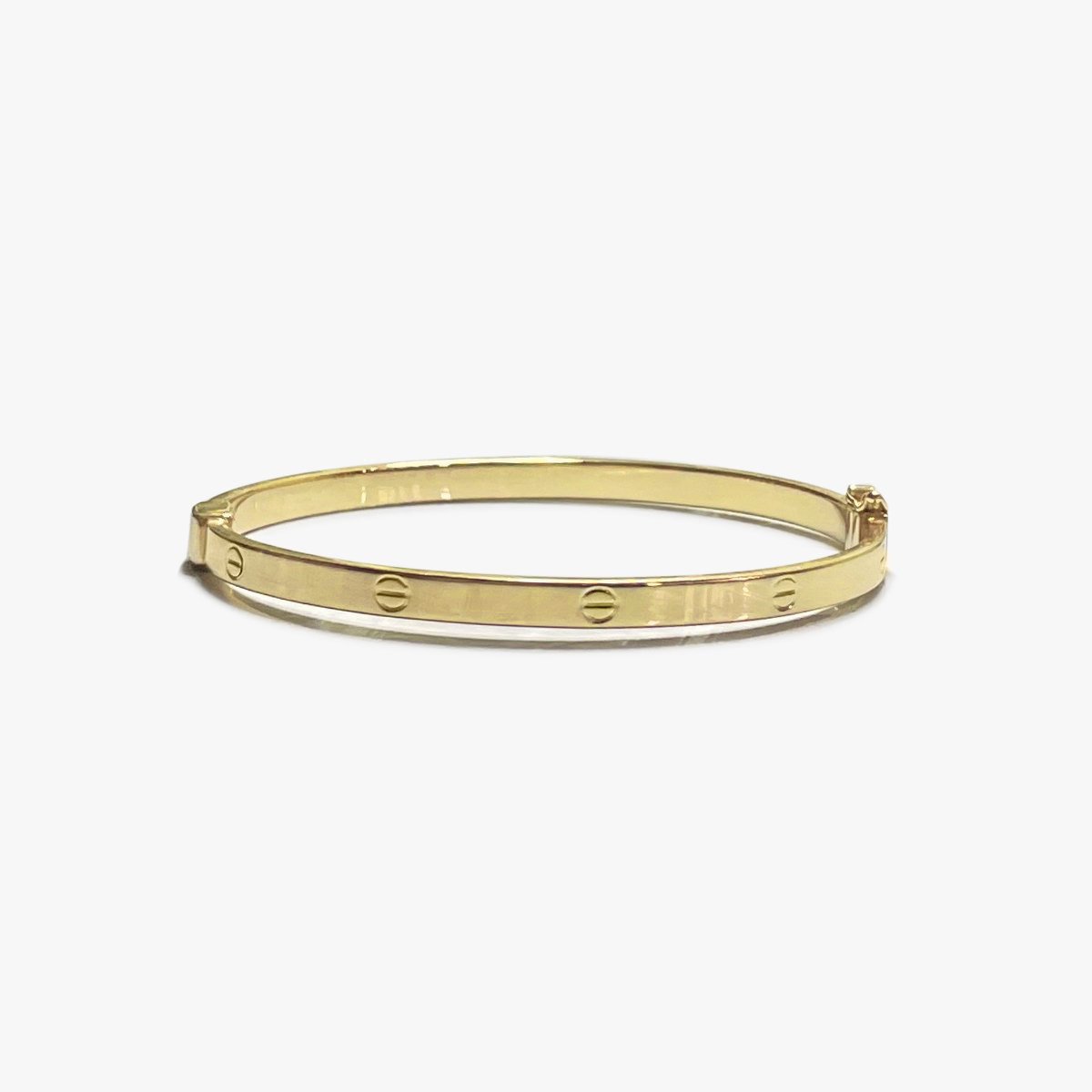 The Slim Designer Clip Lock Bangle in Solid Gold – Flecked with Gold