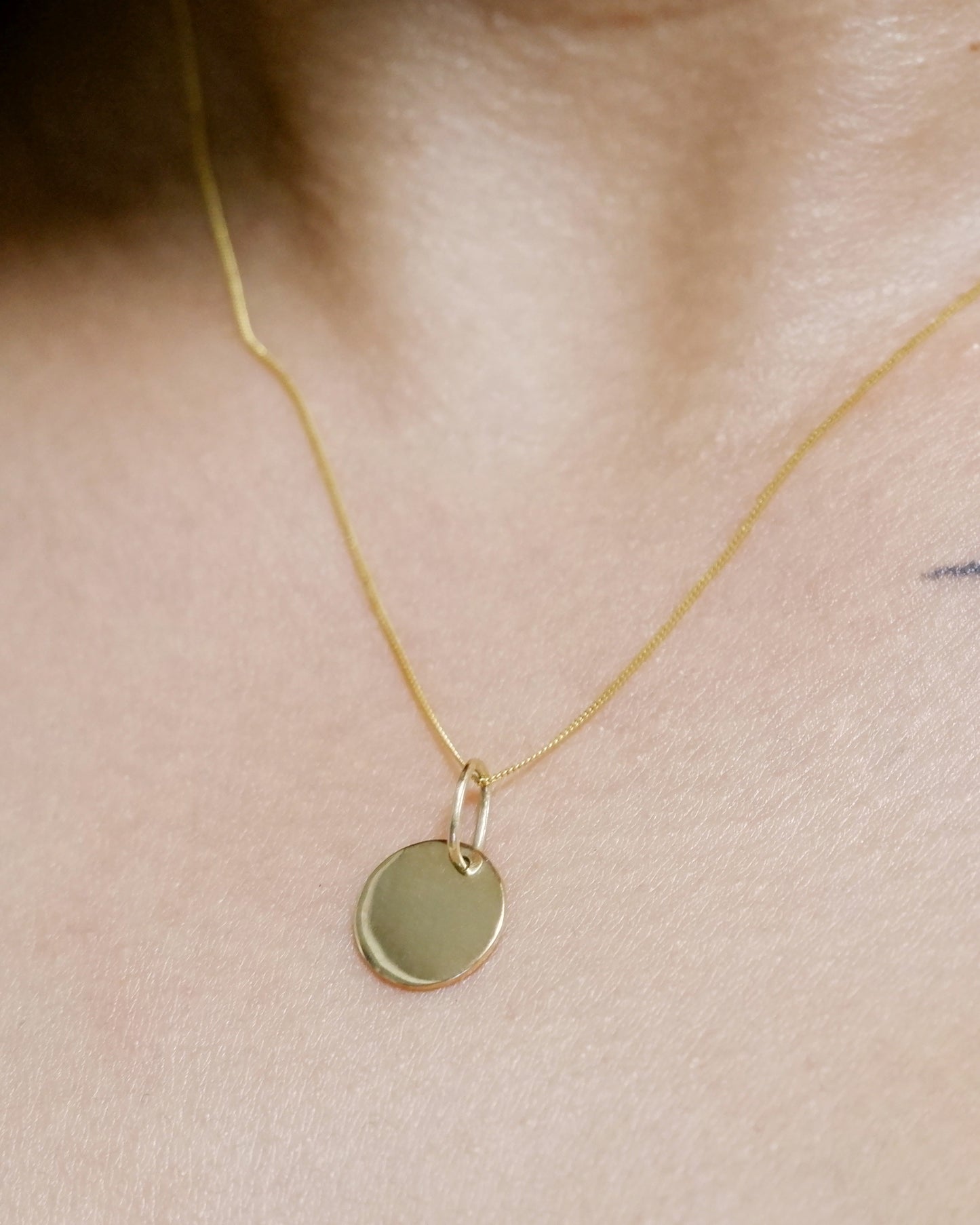 The Tiny Disc Pendant in Solid Gold
