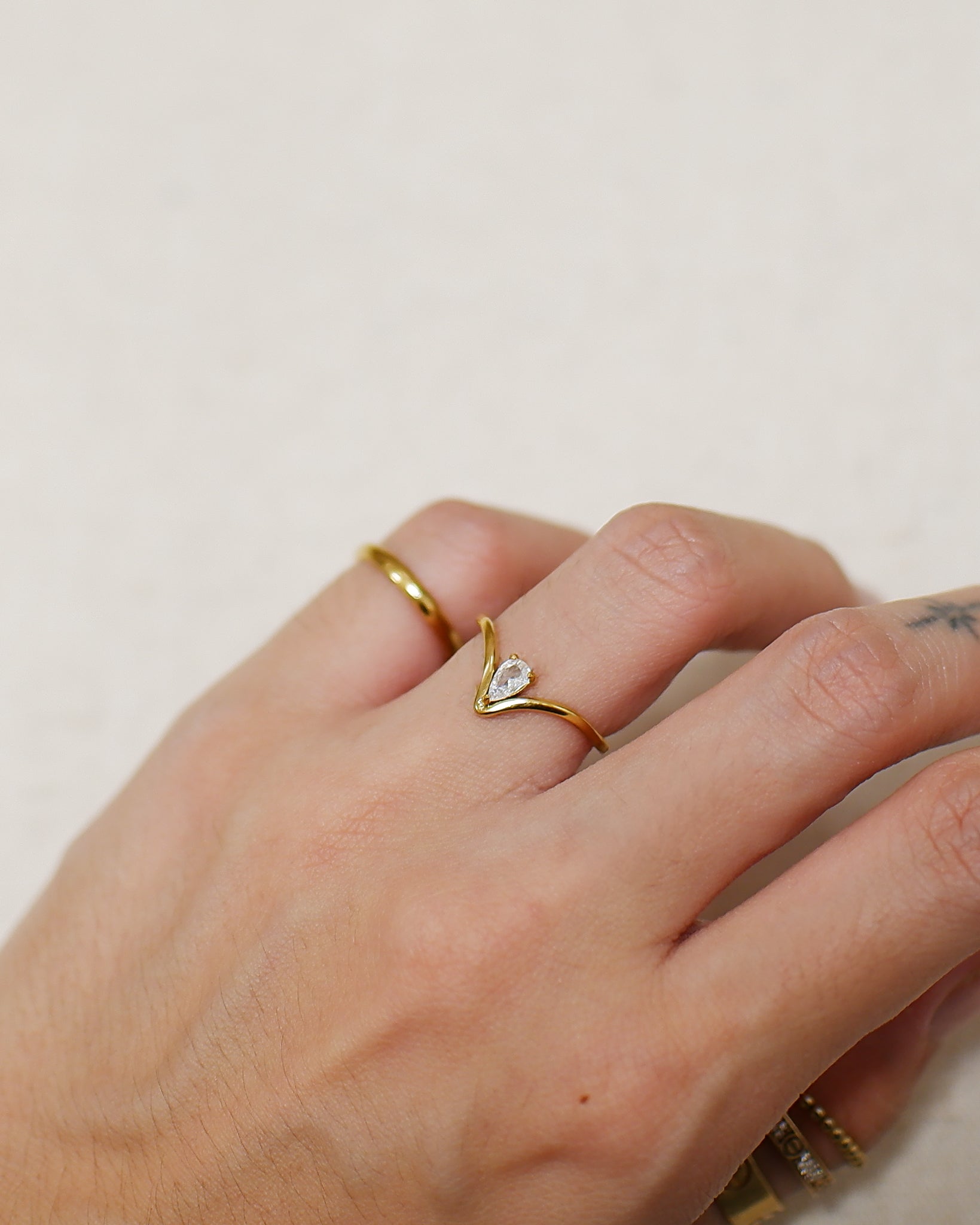 The Ava Floating Pear Ring in Solid Gold