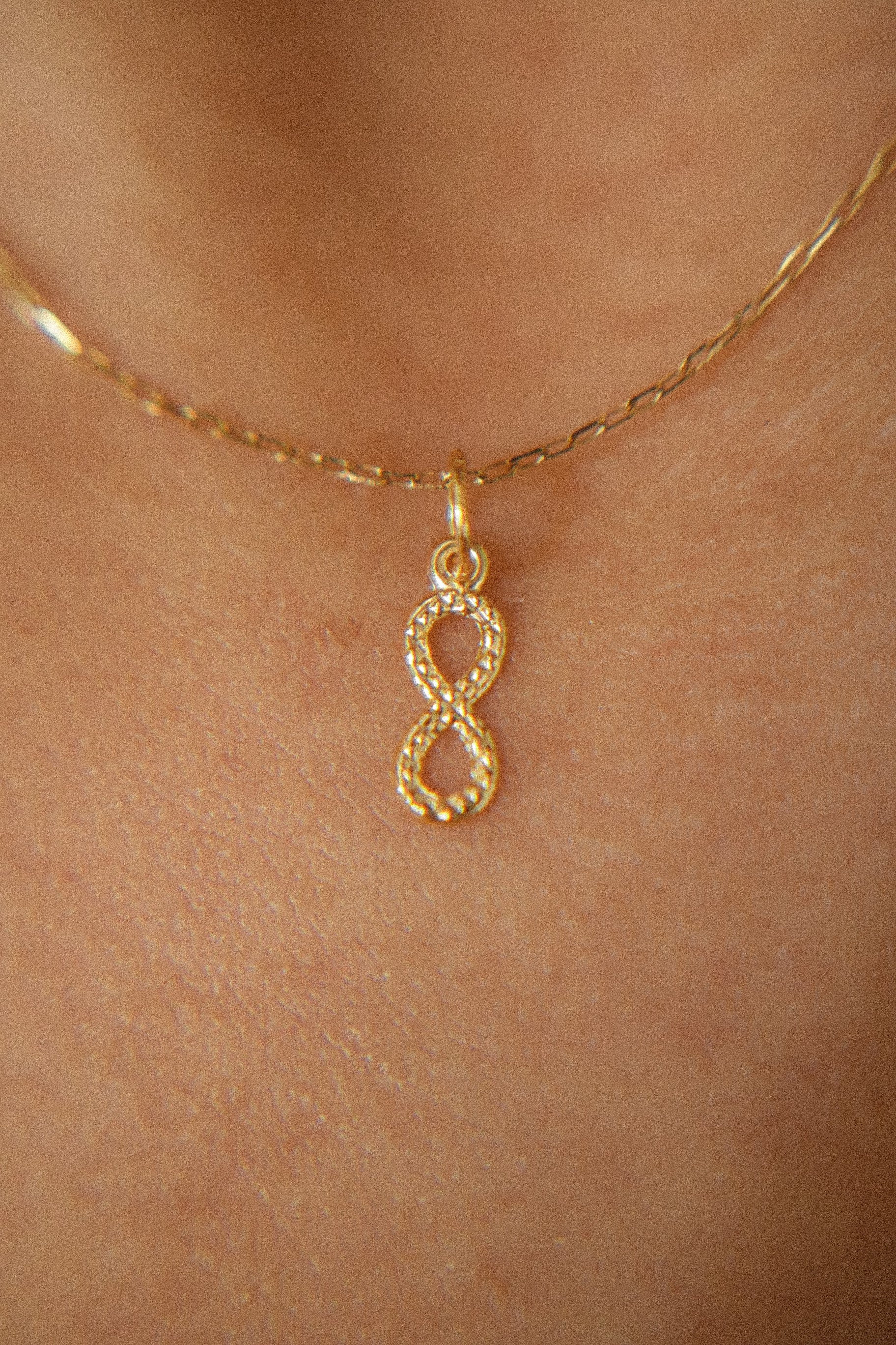 The Mini Dangling Infinity Pendant in Solid Gold