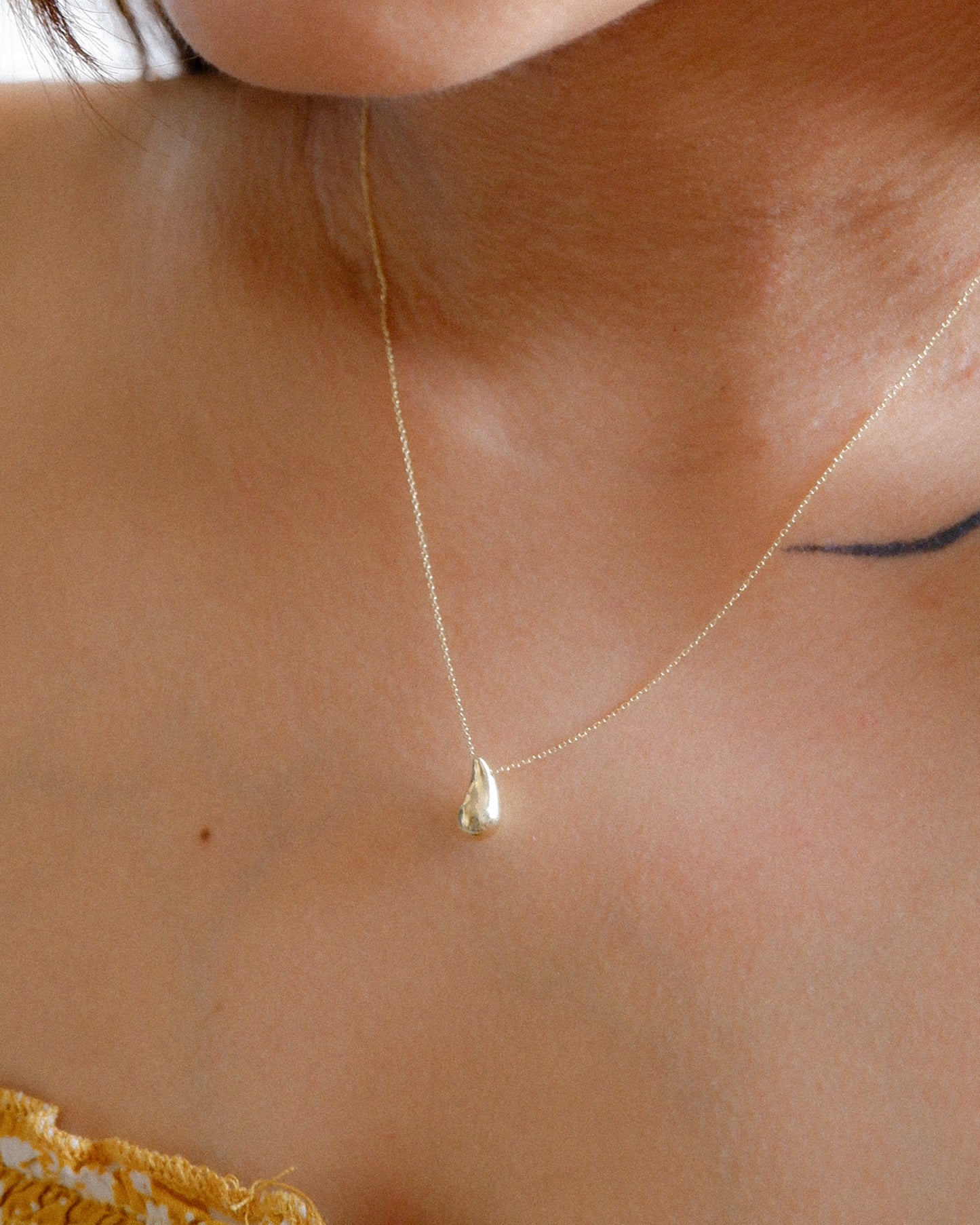 The Water Drop Necklace in Solid Gold