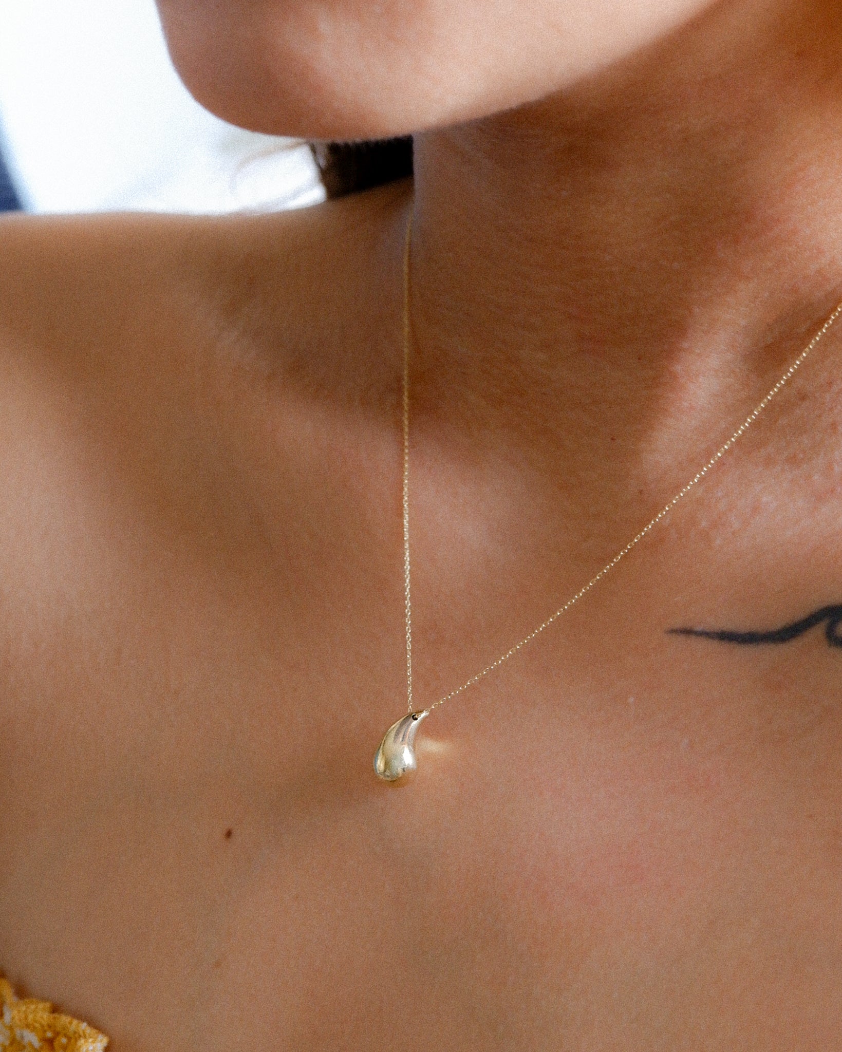 The Water Drop Necklace in Solid Gold