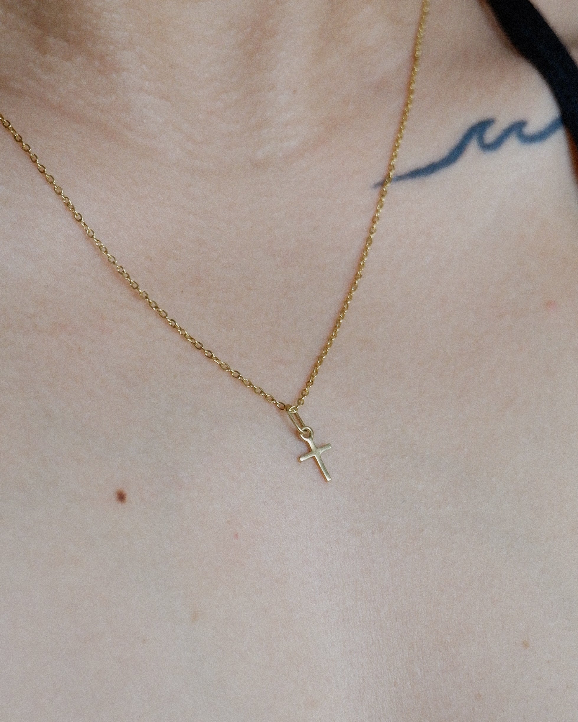 The Mini Cross Necklace in Solid Gold