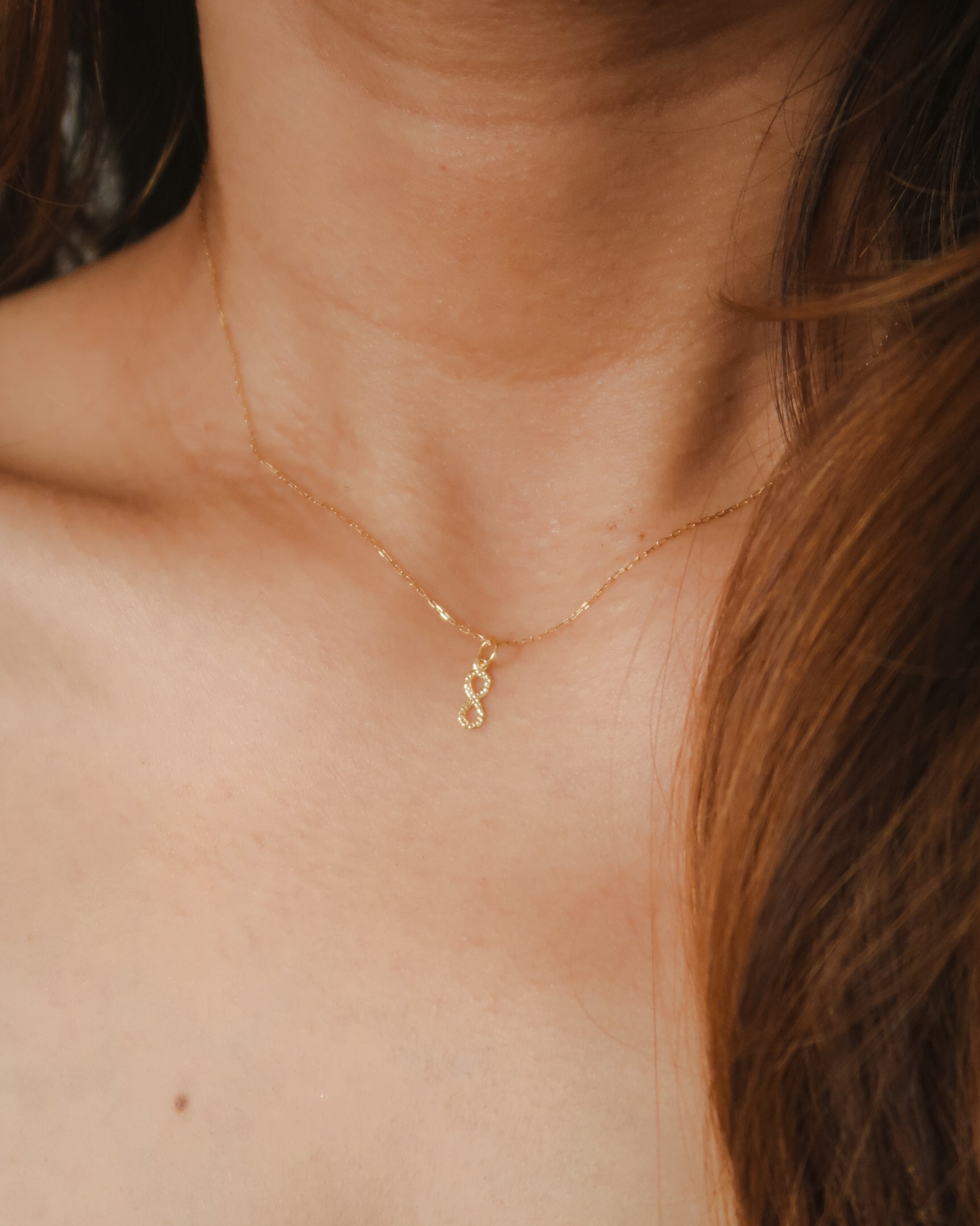 The Mini Dangling Infinity Pendant in Solid Gold