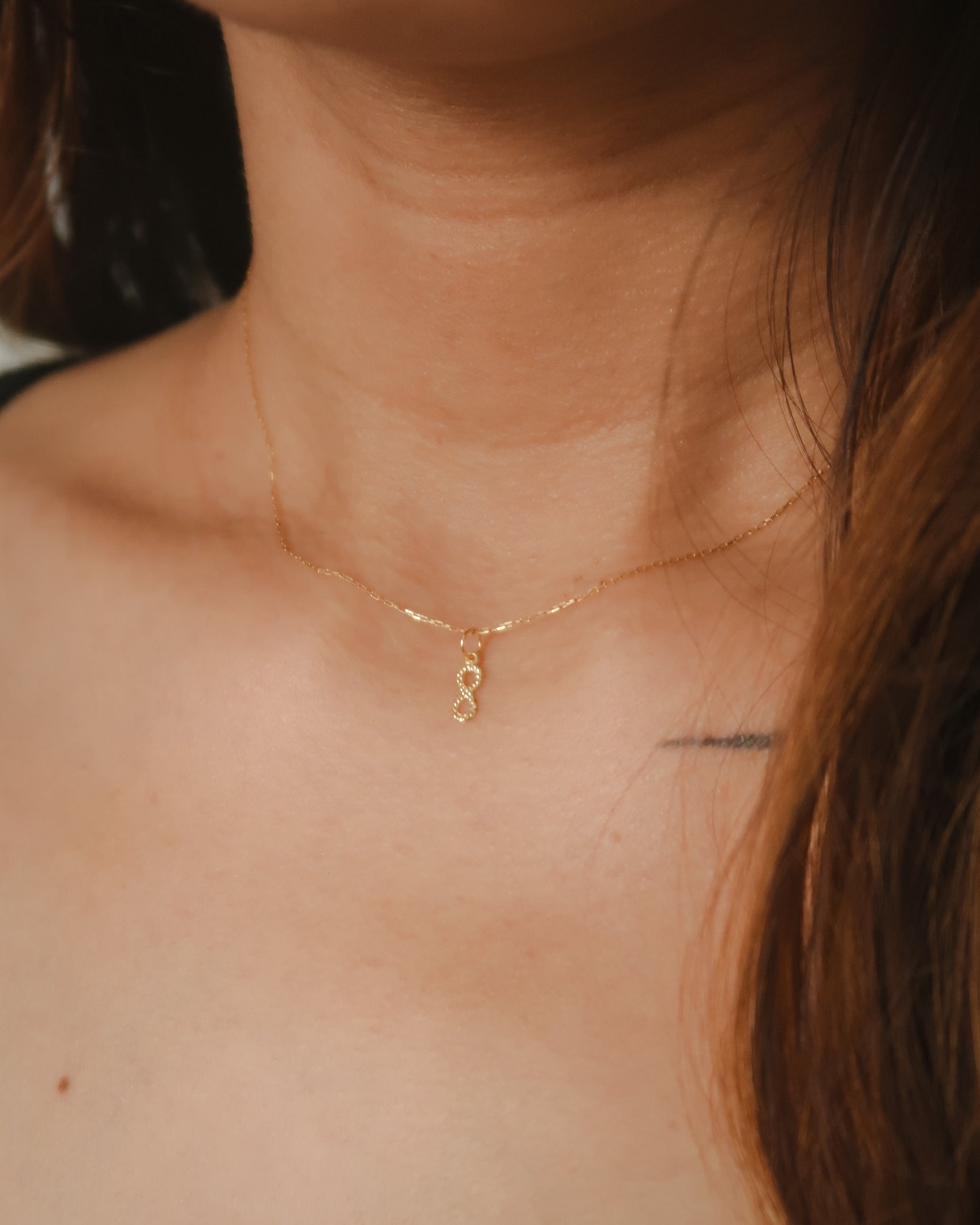 The Mini Dangling Infinity Pendant in Solid Gold