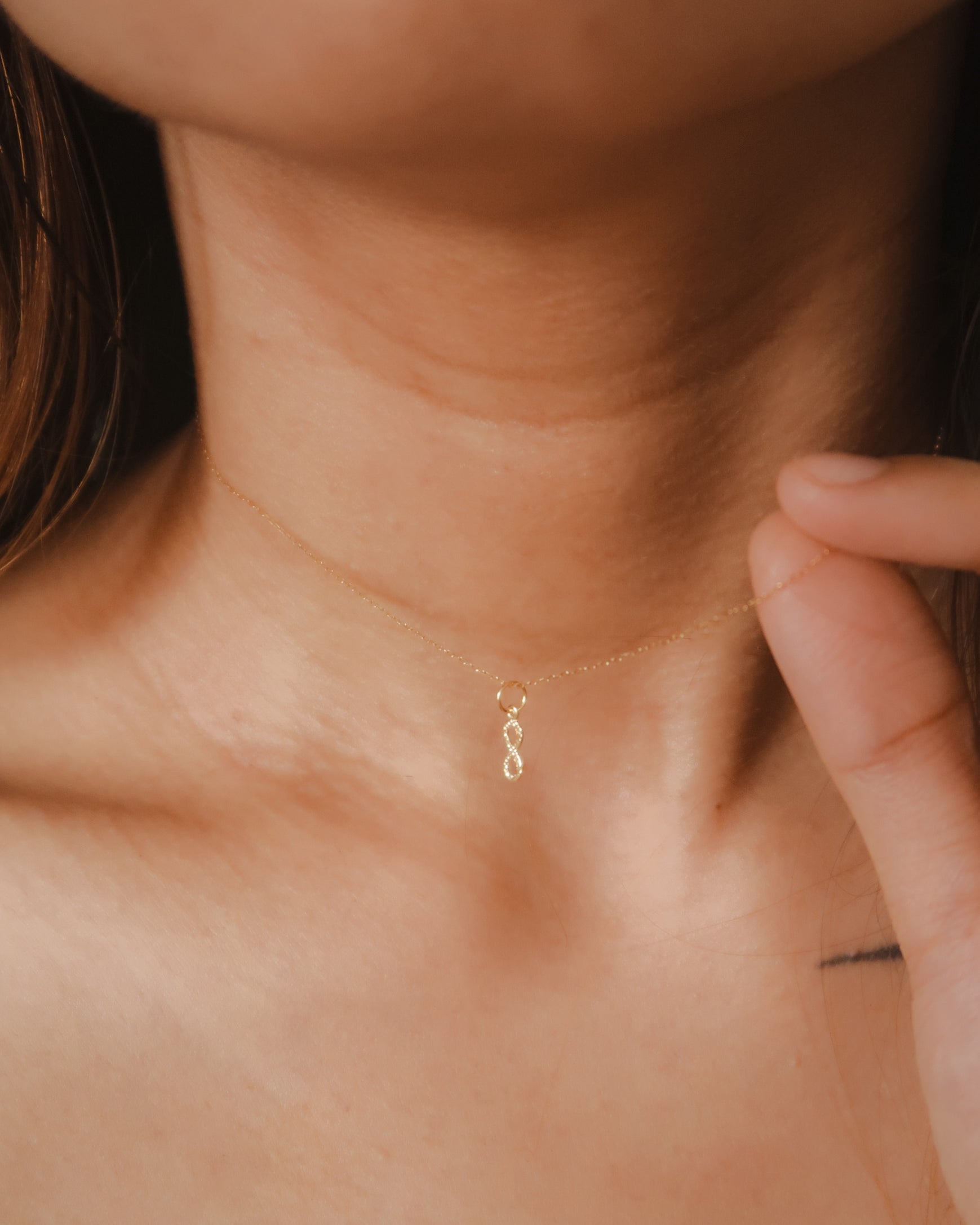 The Mini Dangling Infinity Pendant in Solid Gold
