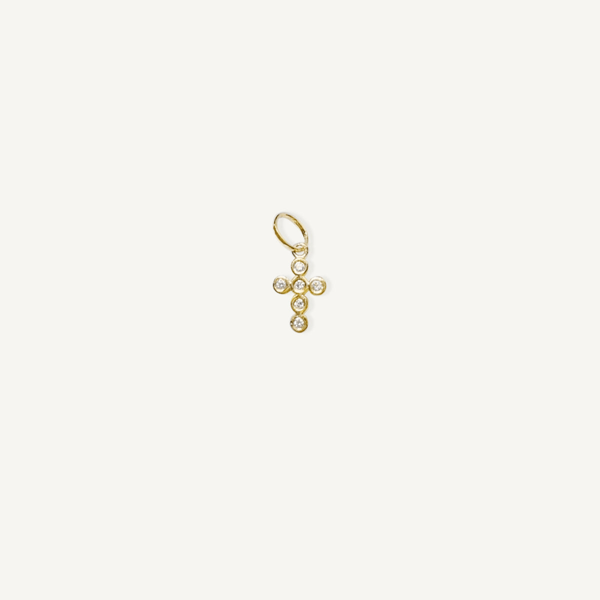 The Bubble Cross Diamond Charm in Solid Gold