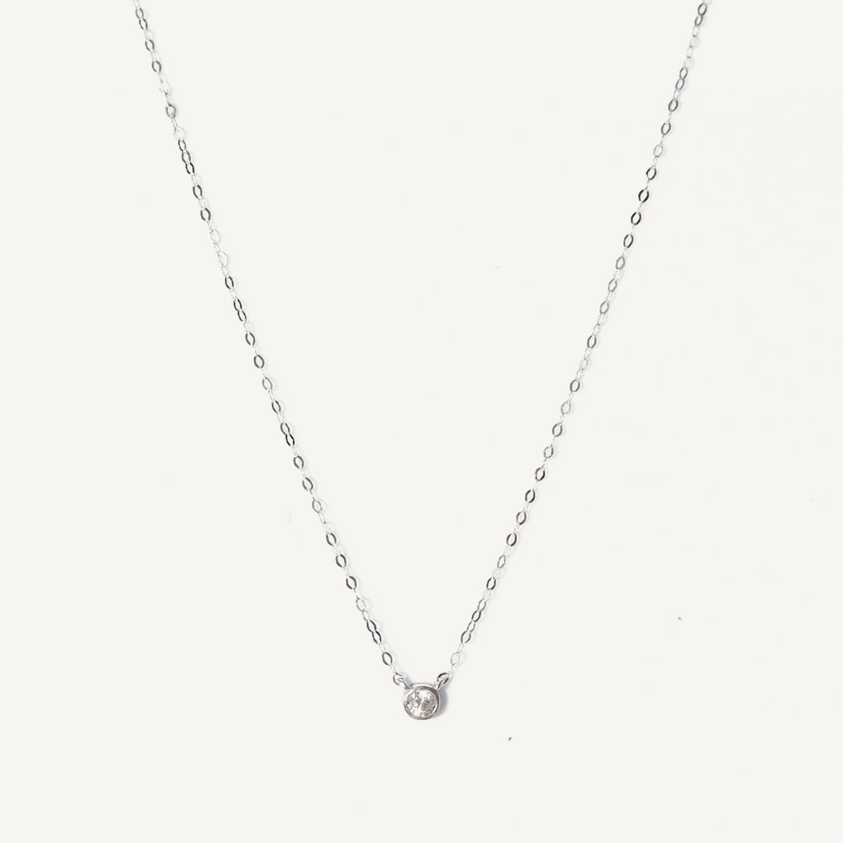 The Tiny Signity Solitaire Necklace in Solid Gold (Rare)