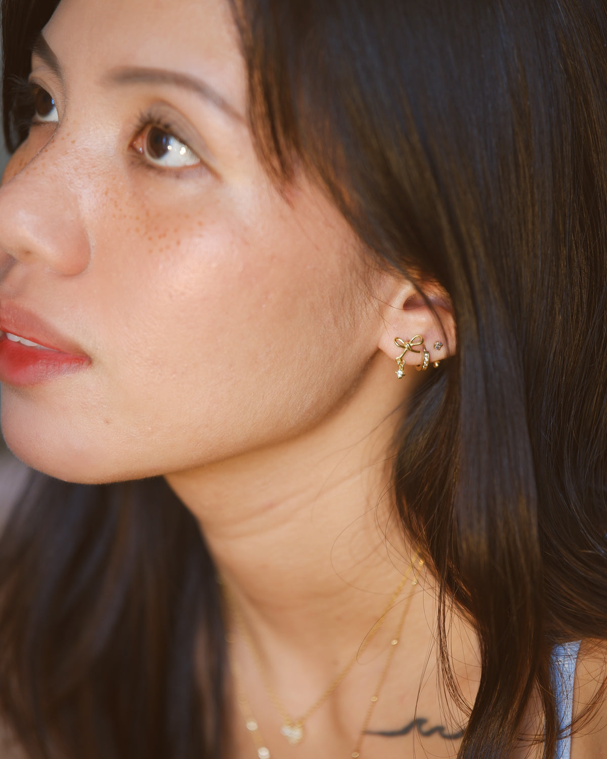 The Dainty Ribbon Dangling Solitaire Earrings