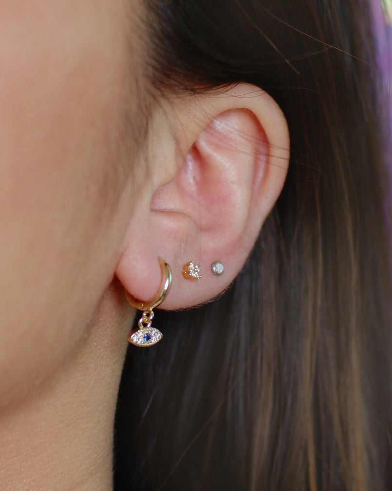 The Tiny Pave Evil Eye Huggies