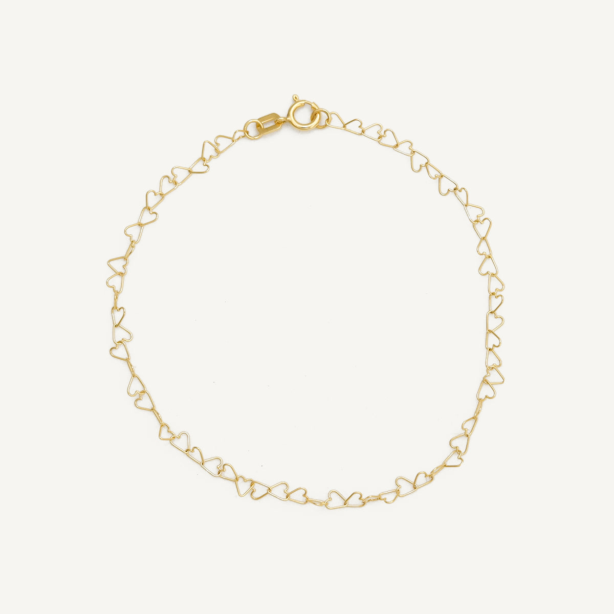 The Mini Heart Link Bracelet in Solid Gold
