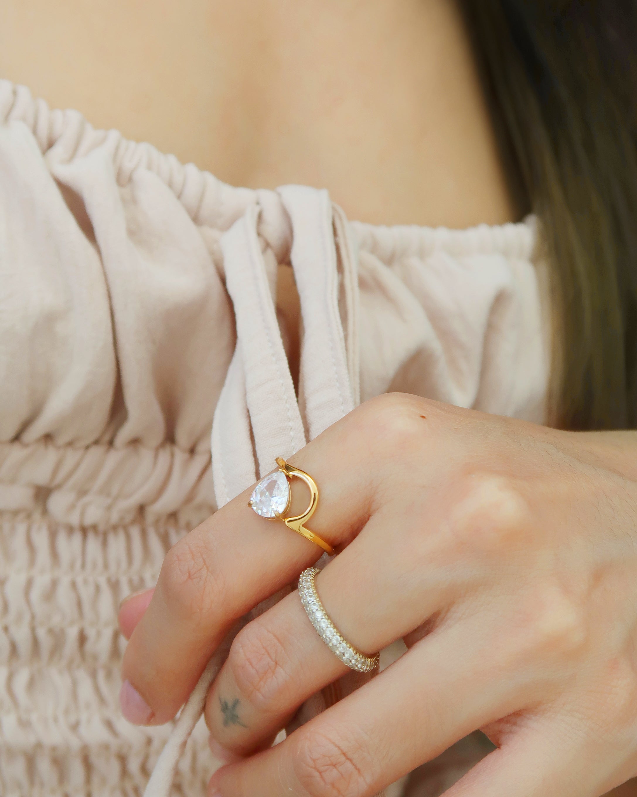 The Nami Wave Pear Solitaire Ring