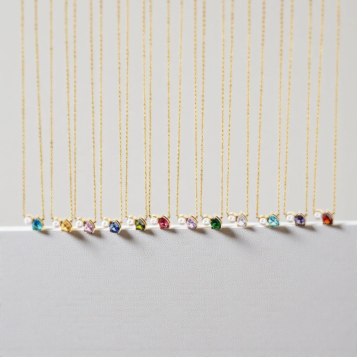 The Signature Floating Pear and Pearl Birthstone Necklace