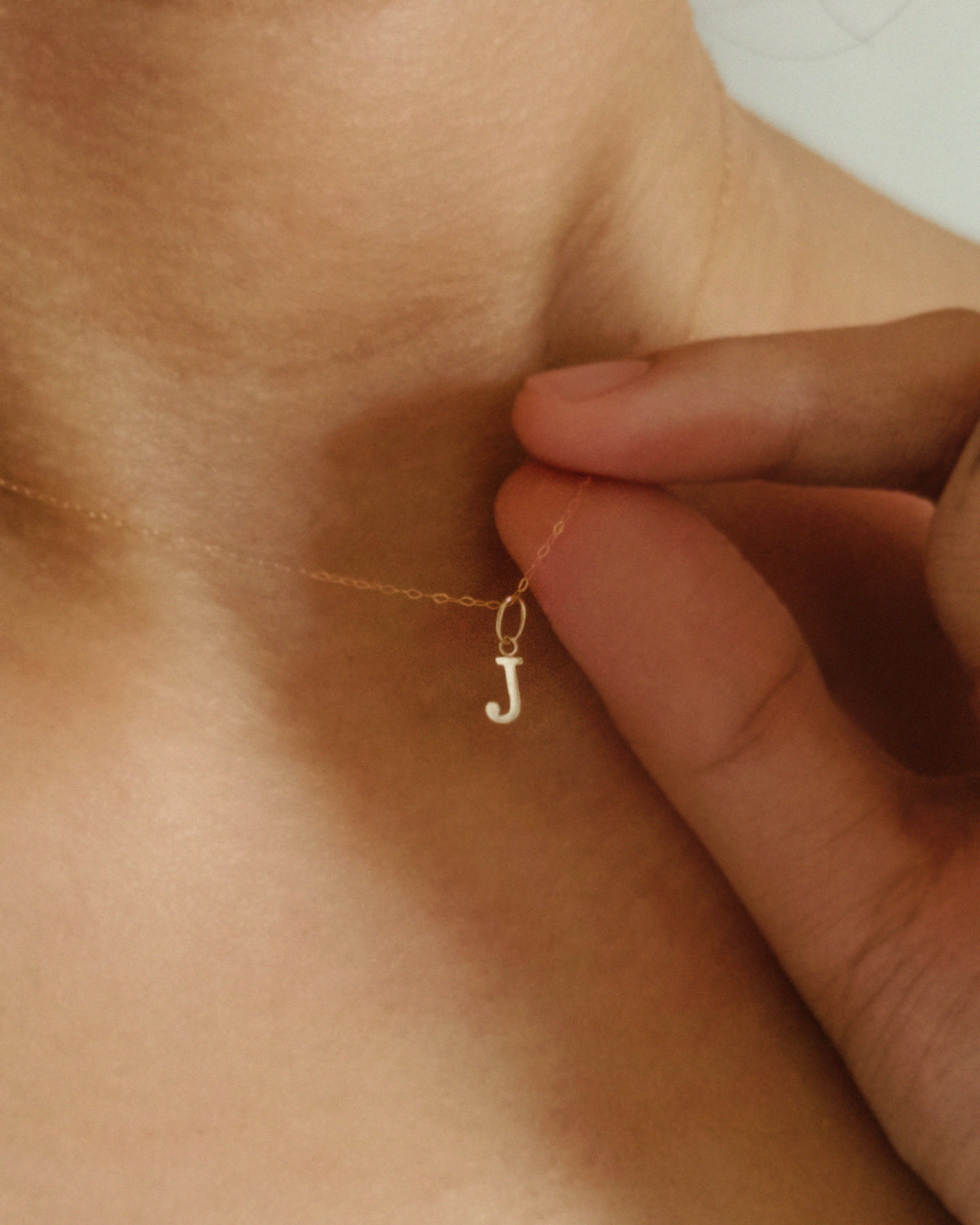 The Tiny Floating Initial Necklace in Solid Gold