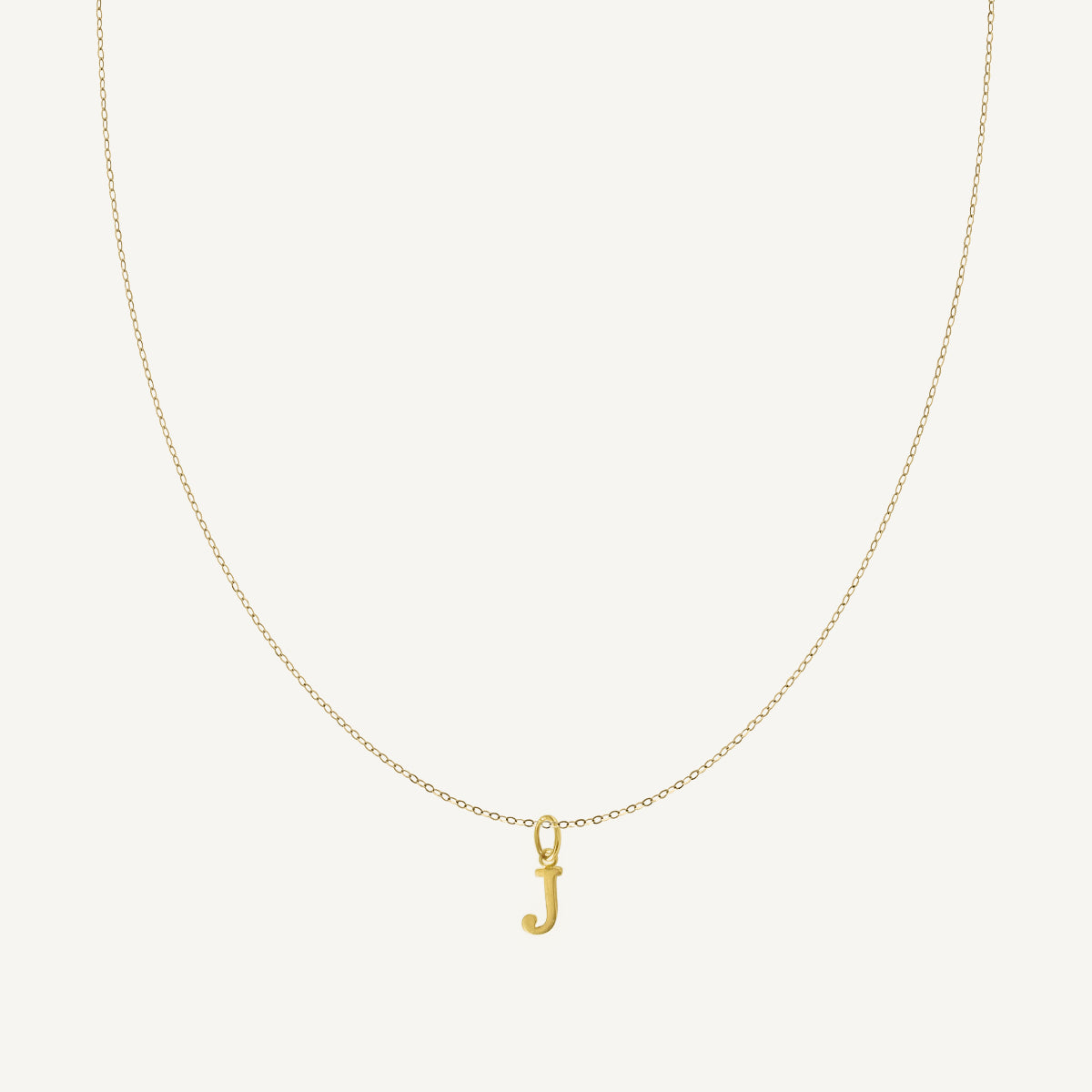 The Tiny Floating Initial Necklace in Solid Gold