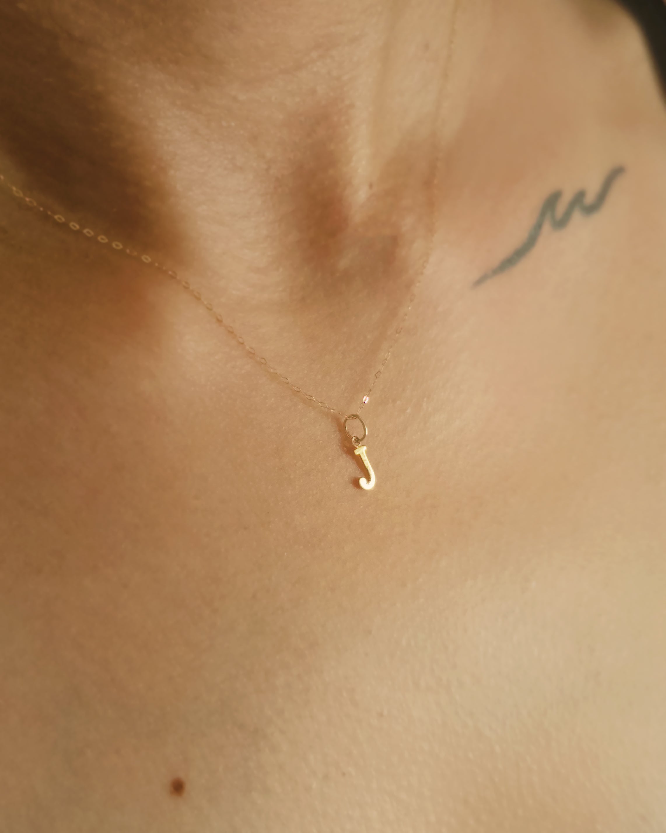 The Tiny Floating Initial Necklace in Solid Gold