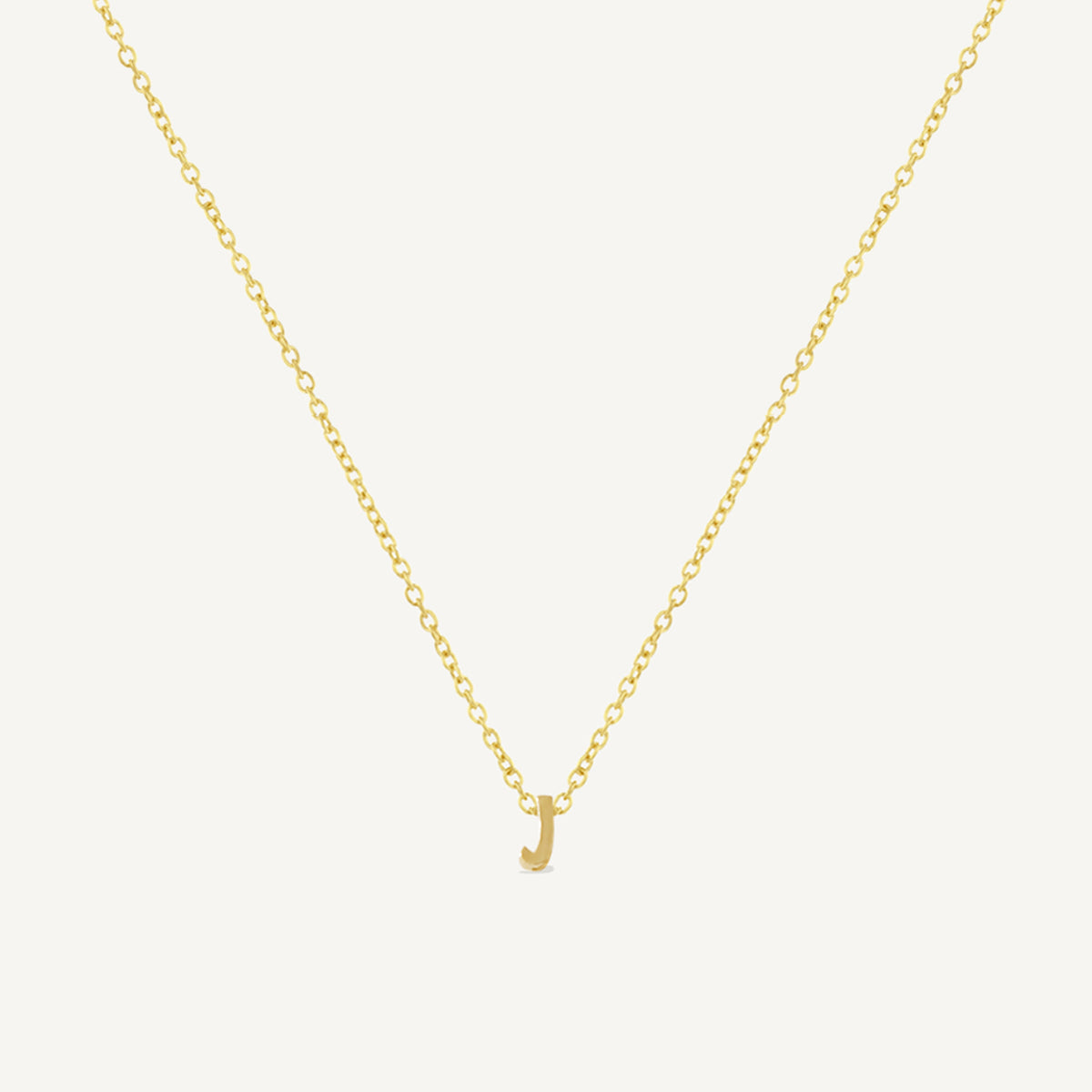 The Tiny Initial Charm in Solid Gold