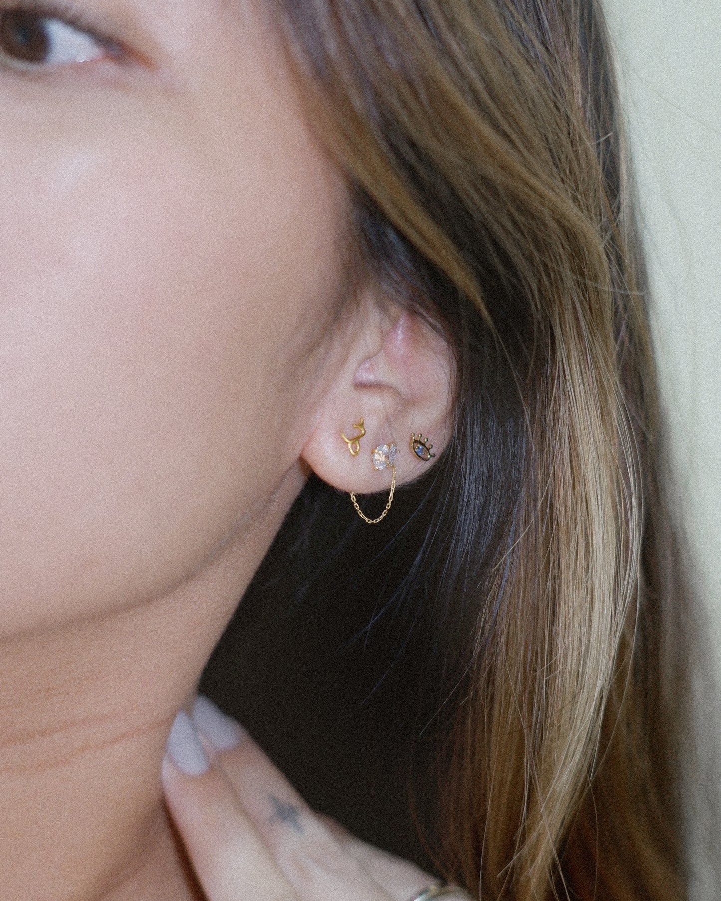 The Tiny Evil Eye Earrings in Solid Gold