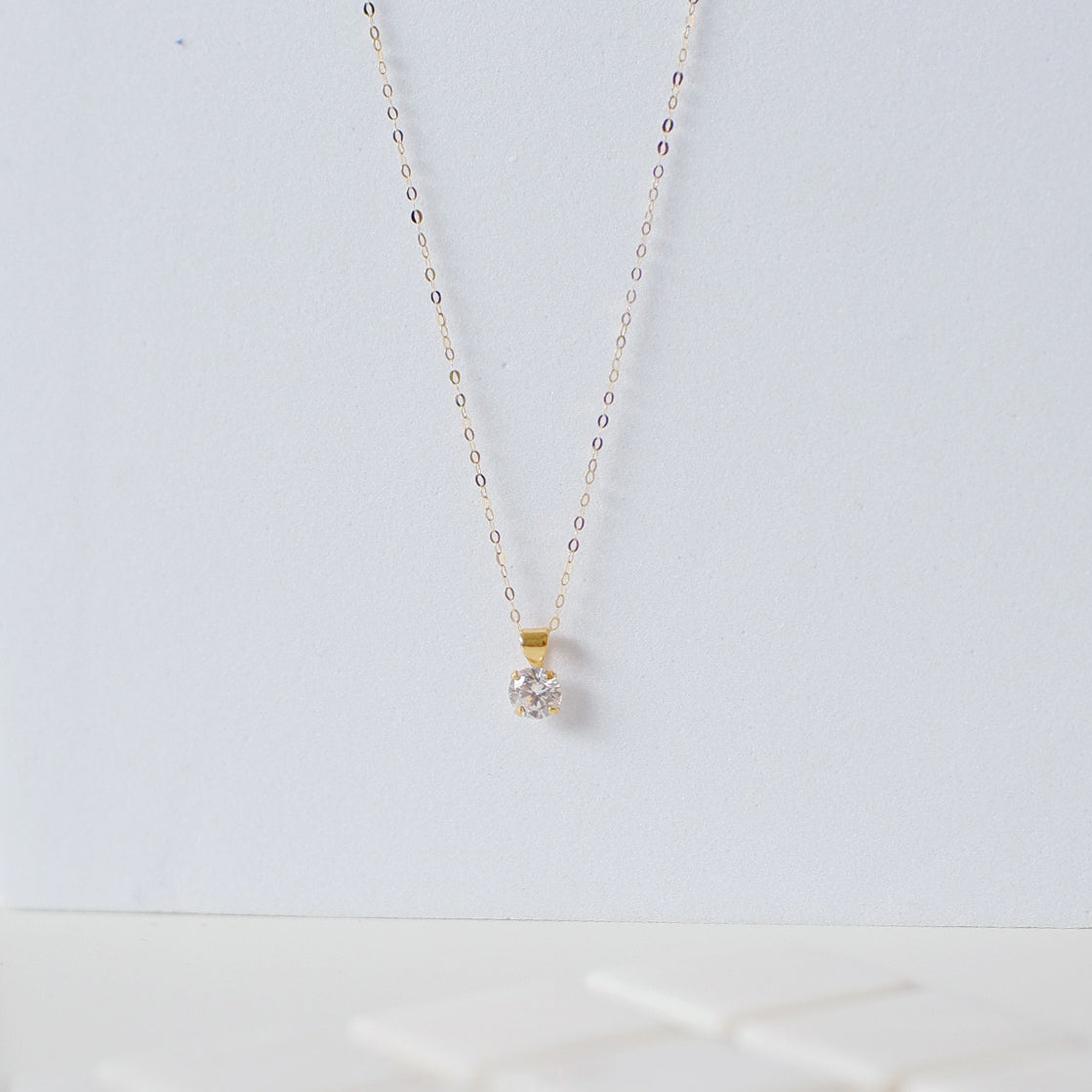 The Mini Solitaire Necklace in Solid Gold