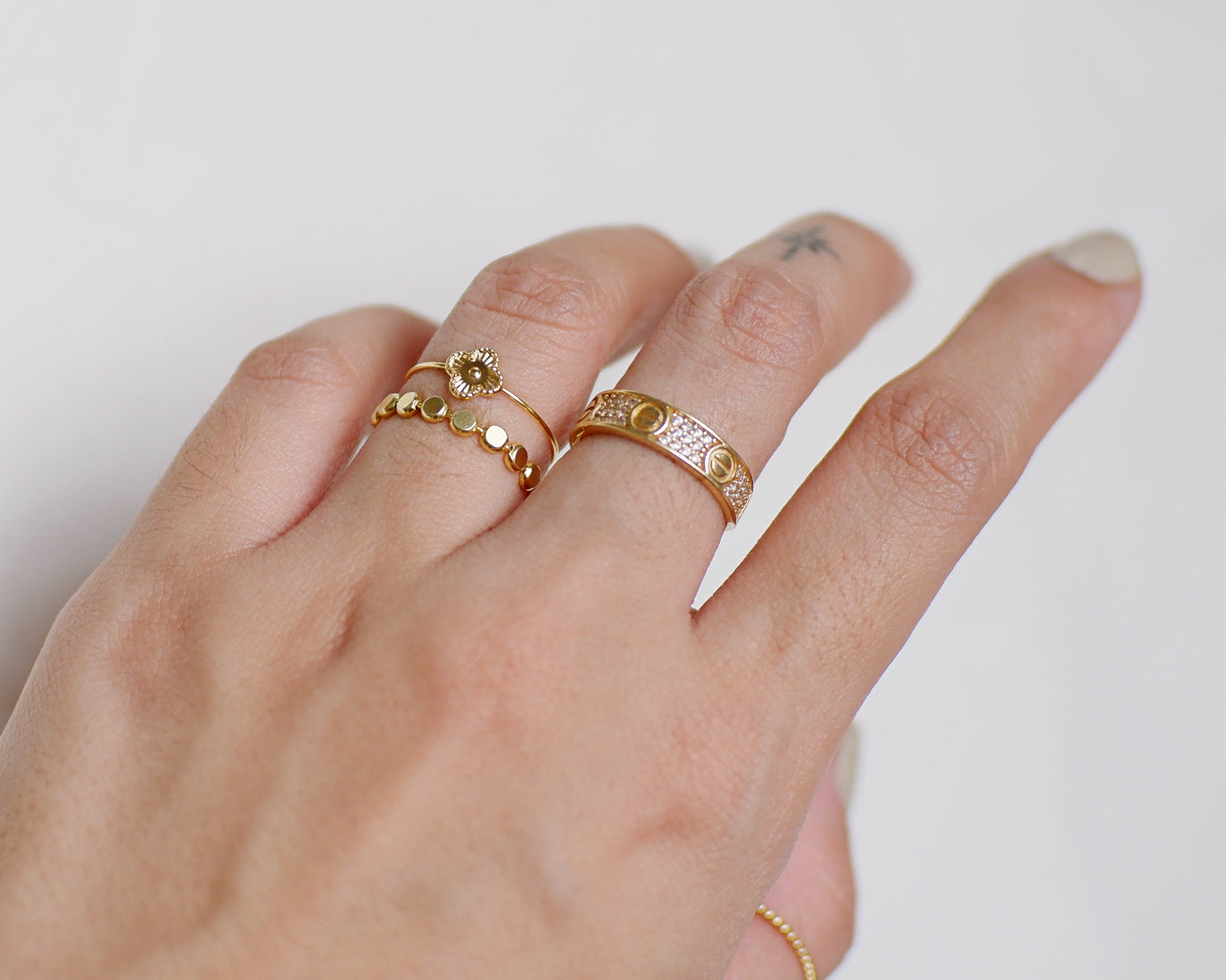 The Barely There Baby Alhambra Ring in Solid Gold