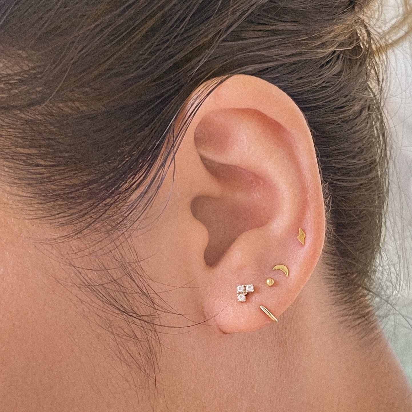 The Tiny Lightning Bolt Studs in Solid Gold