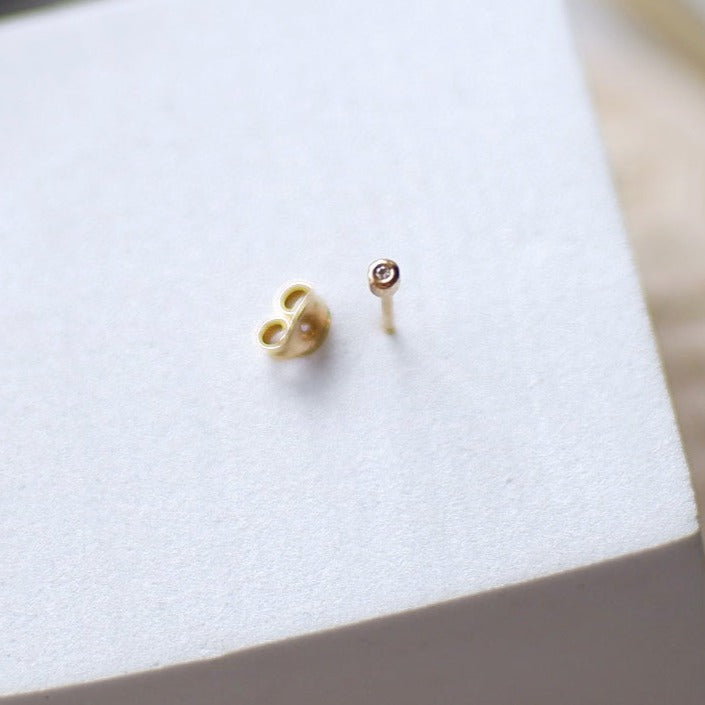 The Tiny Bezel Diamond Earrings in Solid Gold