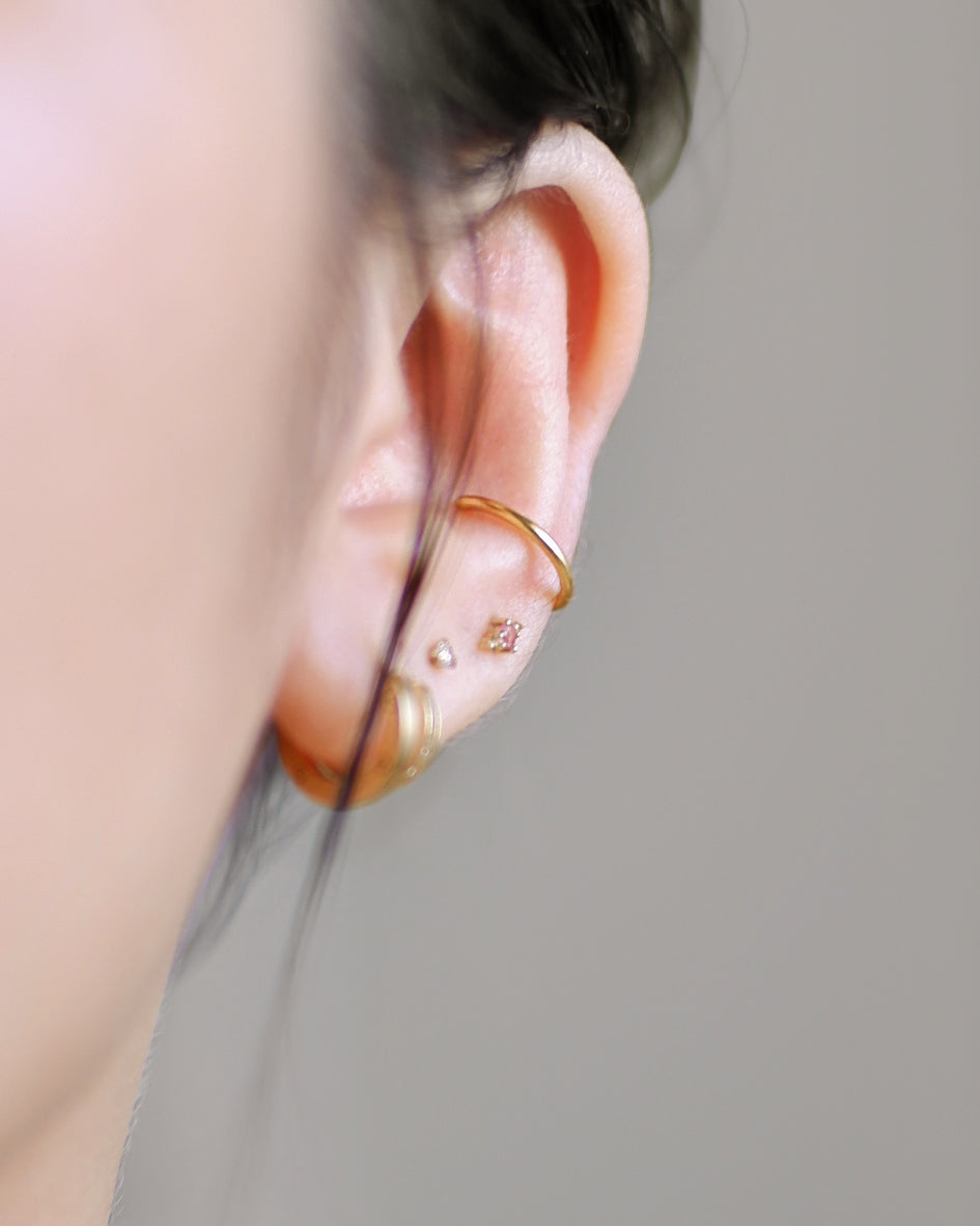 The Tiny Initial Studs in Solid Gold