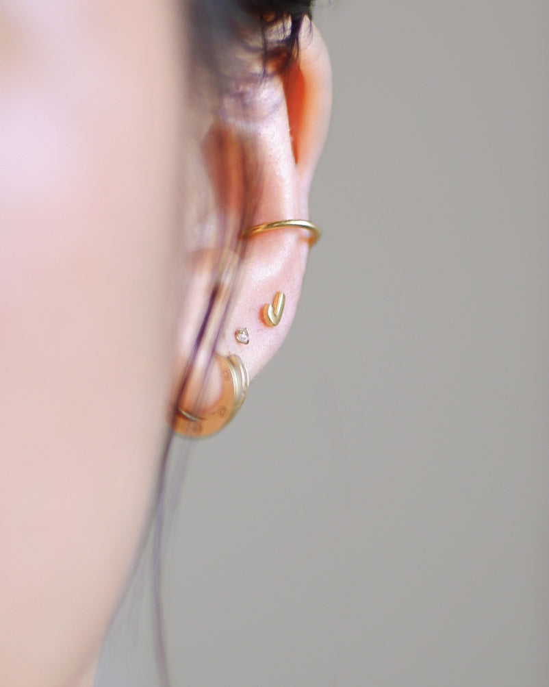 The Tiny Initial Studs in Solid Gold