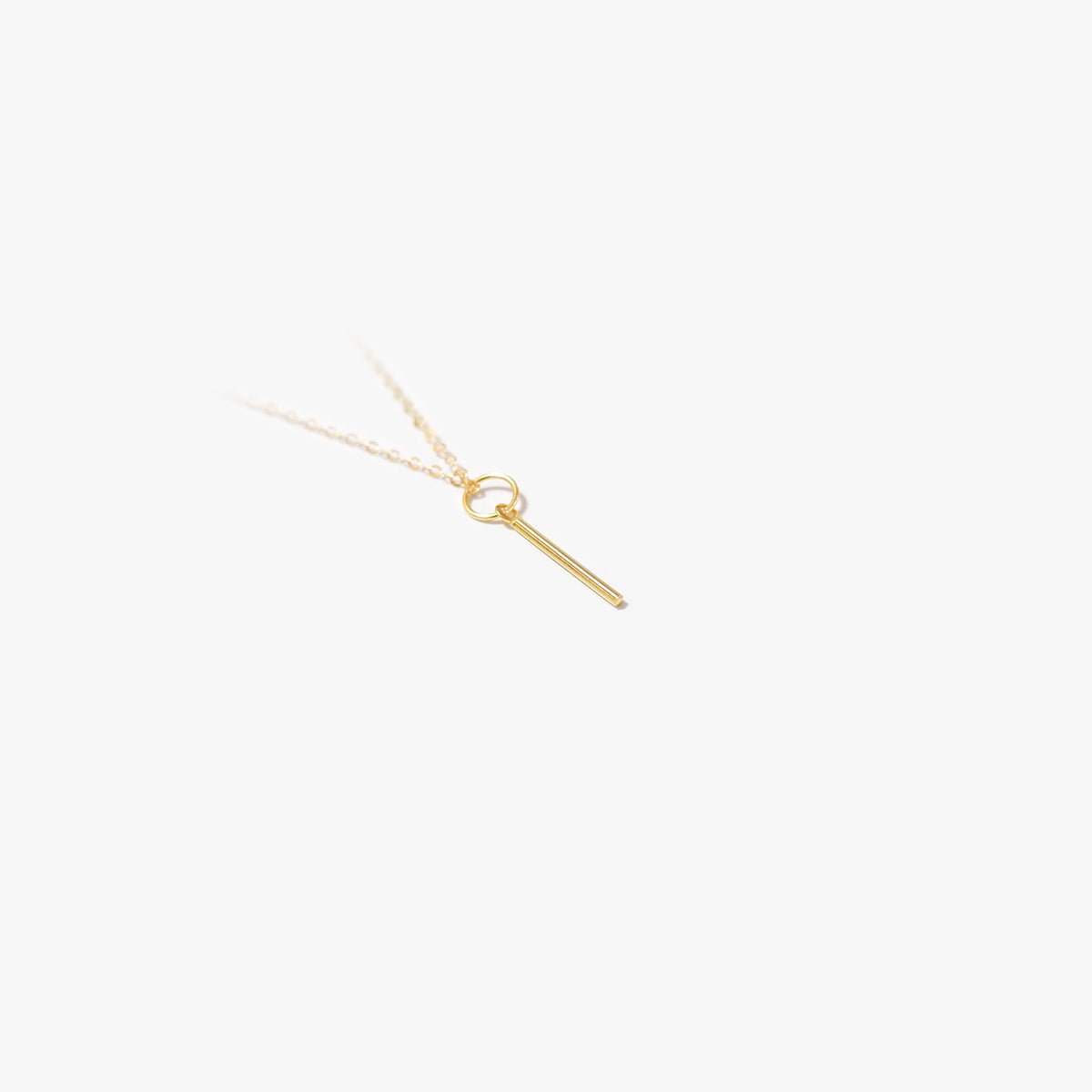 The Tiny Bar Pendant in Solid Gold