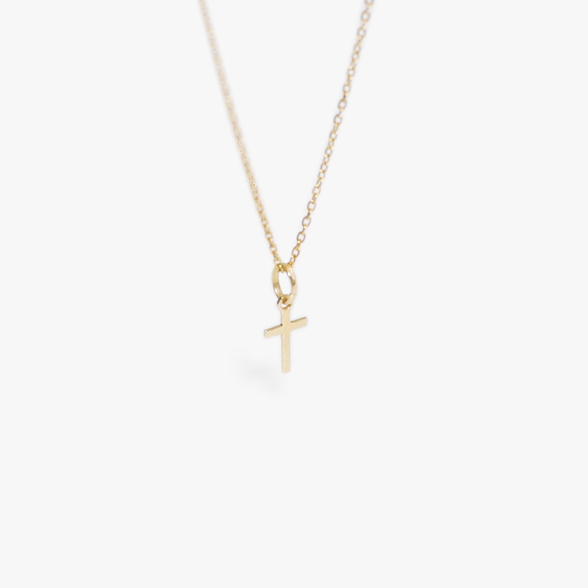 The Mini Cross Necklace in Solid Gold